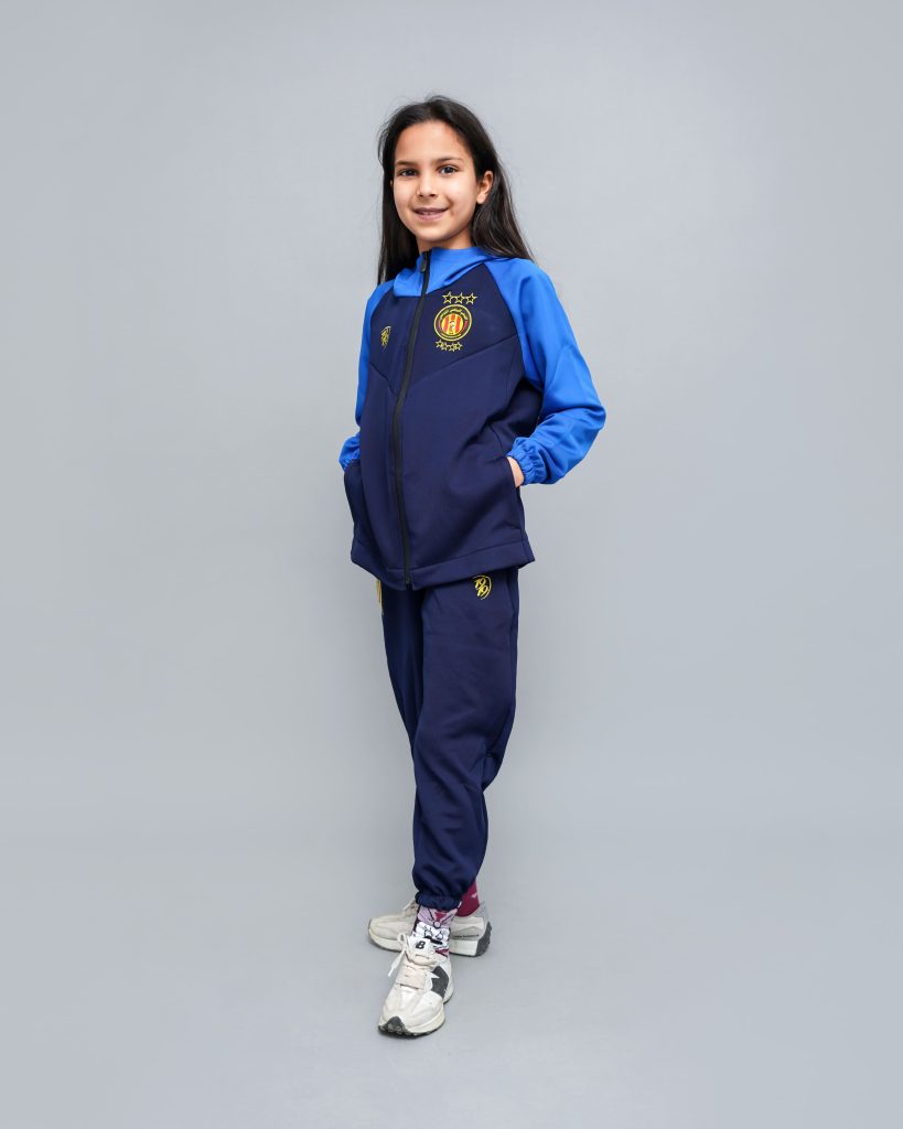 Fille portant le Survêtement Essential 1919 Junior Espérance en bleu marine et bleu roi